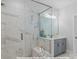 Luxurious shower with marble tiles and a built-in bench at 19728-B School St, Cornelius, NC 28031