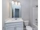 Bathroom features a shower/tub combo, a toilet, and a vanity with a white countertop at 19732-A School St, Cornelius, NC 28031