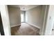 Bedroom with neutral carpet and doorway to walkout patio, ready for relaxation and fresh air at 19732-A School St, Cornelius, NC 28031