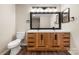 Bathroom with dual sinks and modern vanity at 205 King David Ln, Gastonia, NC 28056