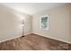 Bedroom featuring vinyl flooring and a window with natural light at 205 King David Ln, Gastonia, NC 28056