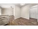 Bright dining area with wood-look flooring, adjacent to the kitchen and featuring stylish modern light fixture at 205 King David Ln, Gastonia, NC 28056