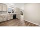 Bright kitchen with modern appliances, custom backsplash, and a view of the backyard through sliding glass doors at 205 King David Ln, Gastonia, NC 28056