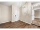 Inviting living room with modern lighting, complemented by neutral walls and elegant wood-look flooring at 205 King David Ln, Gastonia, NC 28056