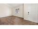 Bright living room with wood-look flooring, featuring a large window that provides ample natural light at 205 King David Ln, Gastonia, NC 28056
