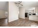 Open-concept living space with wood-look flooring, connecting the kitchen, dining area, and living room at 205 King David Ln, Gastonia, NC 28056