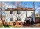 Two-story home's backyard with a deck, grill, and a well-maintained lawn surrounded by trees at 2426 Tory Oak Pl, Matthews, NC 28105