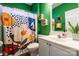 Bright bathroom with a colorful shower curtain and white vanity at 2426 Tory Oak Pl, Matthews, NC 28105