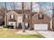 Inviting brick two-story home featuring a two-car garage, well-kept lawn, and traditional design at 2426 Tory Oak Pl, Matthews, NC 28105