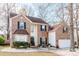 Charming two-story brick home with black shutters and well-maintained landscaping at 2426 Tory Oak Pl, Matthews, NC 28105