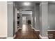 A spacious hallway with hardwood floors and gray walls, offering a view of the home's interior at 2426 Tory Oak Pl, Matthews, NC 28105