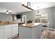 Open concept kitchen with white cabinets and granite countertops, with an island at 2426 Tory Oak Pl, Matthews, NC 28105