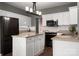 Modern kitchen featuring white cabinets, granite countertops, and stainless steel appliances at 2426 Tory Oak Pl, Matthews, NC 28105
