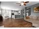 Bright, open-concept layout with hardwood floors connecting the living, dining, and kitchen areas at 2426 Tory Oak Pl, Matthews, NC 28105