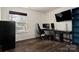 Bright home office space featuring two monitors at 2426 Tory Oak Pl, Matthews, NC 28105