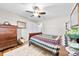 This bedroom has hardwood floors, a ceiling fan, and white walls at 2540 Deal Rd, Mooresville, NC 28115