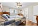 Bedroom with hardwood floors, a window, and a view into the bathroom at 2540 Deal Rd, Mooresville, NC 28115
