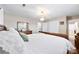 Large bedroom featuring white linens, and a view to the bath and closets at 2540 Deal Rd, Mooresville, NC 28115