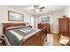 Cozy bedroom featuring wood floors, a ceiling fan, a window, and furniture at 2540 Deal Rd, Mooresville, NC 28115