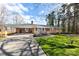 Beautiful brick home with an attached carport and well-maintained lawn, offering great curb appeal and covered parking at 2540 Deal Rd, Mooresville, NC 28115