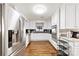 Bright kitchen featuring white cabinetry, granite countertops, stainless steel appliances, and hardwood flooring at 2540 Deal Rd, Mooresville, NC 28115