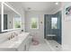 Bright bathroom with a modern vanity, a sleek glass-enclosed shower, and contemporary finishes at 300 Mammoth Oaks Dr, Charlotte, NC 28270