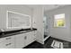 Bathroom with modern vanity, lighted mirror, and walk-in shower with glass enclosure and sleek black hardware at 300 Mammoth Oaks Dr, Charlotte, NC 28270