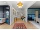 Bright foyer featuring a hardwood floor, modern light fixture, and an open floor plan at 300 Mammoth Oaks Dr, Charlotte, NC 28270