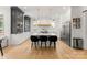 Bright kitchen with two-tone cabinetry, a large island with seating, stainless appliances, and hardwood floors at 300 Mammoth Oaks Dr, Charlotte, NC 28270