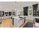 Open concept kitchen with an island, stainless steel appliances, bar seating and views of the Gathering room at 300 Mammoth Oaks Dr, Charlotte, NC 28270