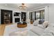 Open concept living room with a cozy fireplace, modern lighting, and sliding doors to patio at 300 Mammoth Oaks Dr, Charlotte, NC 28270