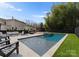 Inviting backyard pool and lounge area features travertine tile, fountain features, and ample space for relaxing at 300 Mammoth Oaks Dr, Charlotte, NC 28270