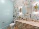 Charming powder room with floral wallpaper, marble countertop, and designer fixtures at 300 Mammoth Oaks Dr, Charlotte, NC 28270