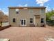 Home exterior featuring brick patio, large windows, and mature landscaping at 3140 S Legacy Park Blvd, Fort Mill, SC 29707