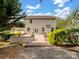 A view of the backyard featuring a brick patio and mature landscaping at 3140 S Legacy Park Blvd, Fort Mill, SC 29707