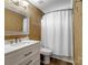 Bright bathroom includes a single vanity, tile floors, and a shower with curtain at 3140 S Legacy Park Blvd, Fort Mill, SC 29707