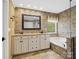 Elegant bathroom featuring double vanity, soaking tub, and decorative tile at 3140 S Legacy Park Blvd, Fort Mill, SC 29707