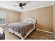 Cozy bedroom features a ceiling fan, a plush bed, and hardwood floors at 3140 S Legacy Park Blvd, Fort Mill, SC 29707