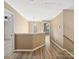 Upstairs hallway with neutral walls and trim and vinyl plank floors at 3140 S Legacy Park Blvd, Fort Mill, SC 29707