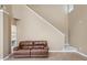 Cozy living room featuring a brown leather loveseat sofa, and bright neutral paint at 3140 S Legacy Park Blvd, Fort Mill, SC 29707