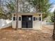 A exterior front view of the shed with black doors and shutters at 3140 S Legacy Park Blvd, Fort Mill, SC 29707