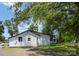 Backyard with mature trees and a well-maintained house exterior at 400 E 1St St, Cherryville, NC 28021