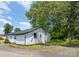 Backyard featuring a lush lawn, and a well-kept exterior with trees at 400 E 1St St, Cherryville, NC 28021