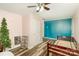 Bedroom featuring hardwood floors, light blue walls, and a window at 400 E 1St St, Cherryville, NC 28021