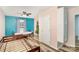 Bedroom featuring hardwood floors, a window and light blue walls at 400 E 1St St, Cherryville, NC 28021