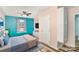 Bedroom featuring hardwood floors, a bed, and light blue walls at 400 E 1St St, Cherryville, NC 28021