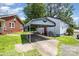 Exterior showcasing the house and a covered parking area with well-maintained landscaping at 400 E 1St St, Cherryville, NC 28021