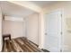 Hallway features wood-look floors, neutral paint, and convenient access to multiple rooms at 400 E 1St St, Cherryville, NC 28021