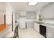 Bright kitchen with updated cabinets, granite countertops, and stainless steel sink at 400 E 1St St, Cherryville, NC 28021