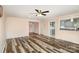 Inviting living room boasts wood floors, a ceiling fan, and seamless flow to the kitchen at 400 E 1St St, Cherryville, NC 28021